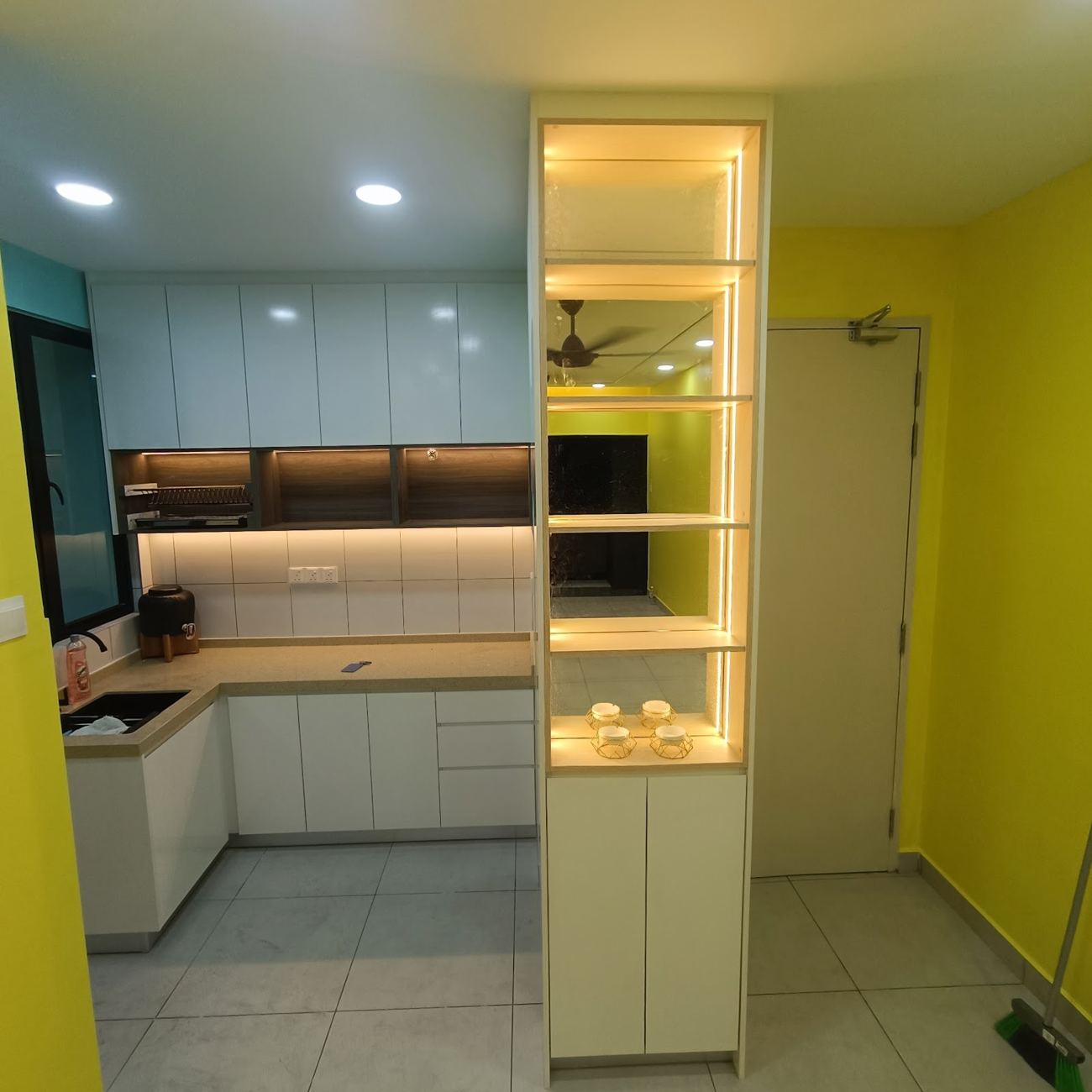Kitchen cabinets and lit display cabinet